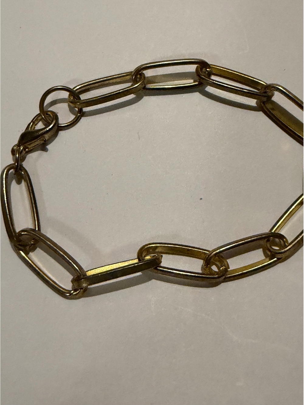 Gold tone paperclip link bracelet